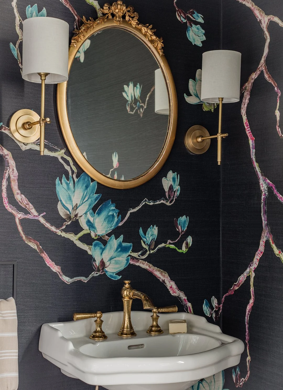 Sacris Design dramatic powder room with navy magnolia mural, ornate gold mirror and antique pedestal sink, North Shore Massachusetts