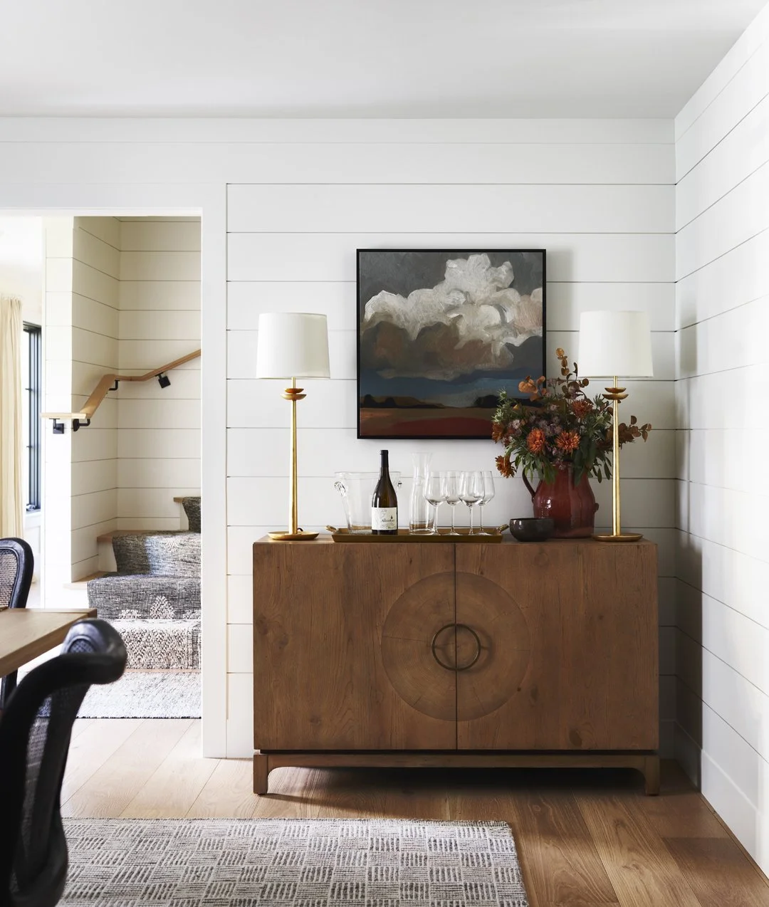 Sacris Design high end interior design dining area with shiplap walls and white oak sideboard, serving New Hampshire, Maine and North Shore MA