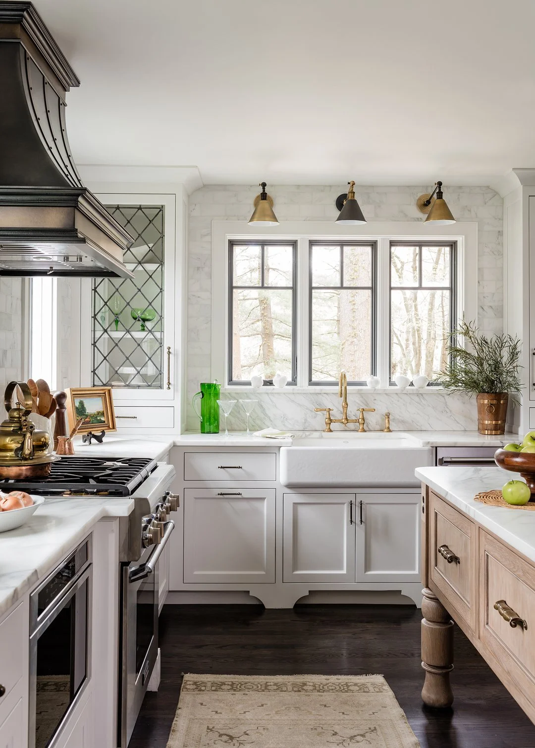 Sacris Design historic renovation kitchen with farmhouse sink, marble backsplash and custom bronze range hood, Andover Massachusetts