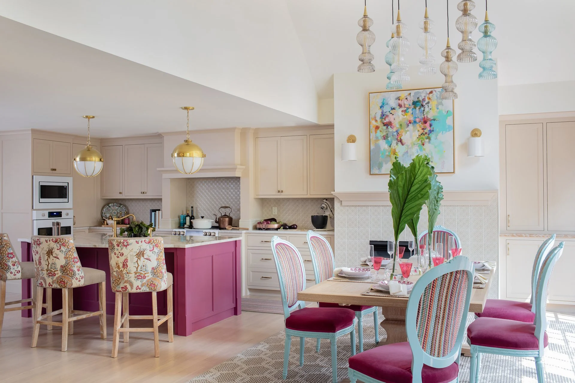 SACRIS New Castle New Hampshire open plan kitchen and dining room with painted raspberry island, colorful chairs and vaulted ceiling, Portsmouth NH