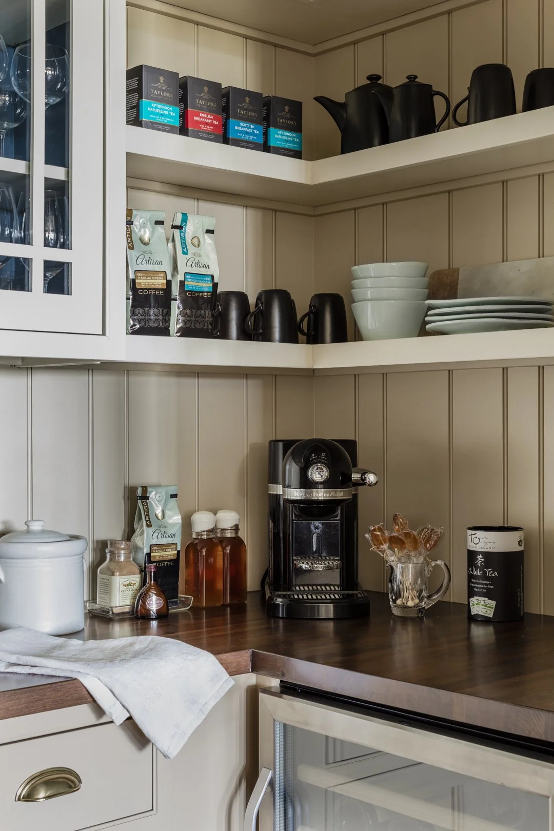 Butler's pantry coffee and tea station with beadboard paneling, open shelving, and walnut countertop — luxury kitchen interior design by Sacris Interior Architecture and Design, serving the North Shore of Massachusetts and Maine