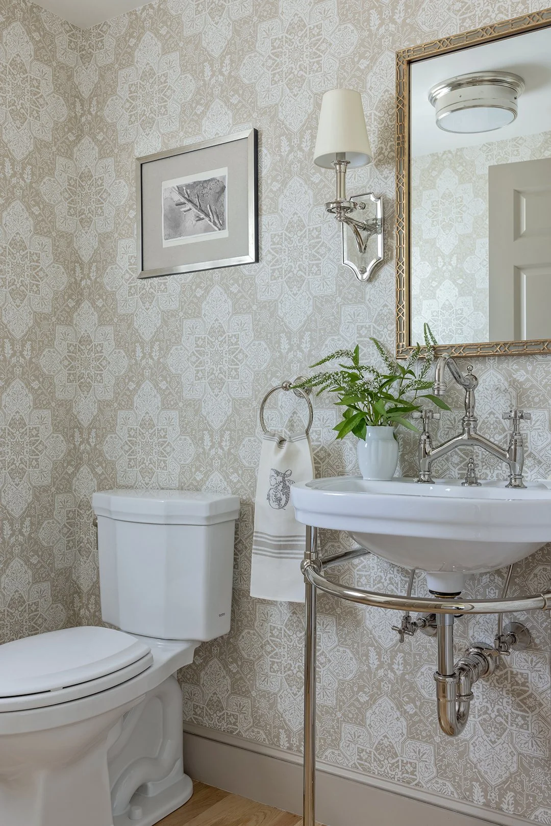 Sacris Design cape powder room with geometric print wallpaper, polished nickel console sink fixtures, Merrimack Valley MA