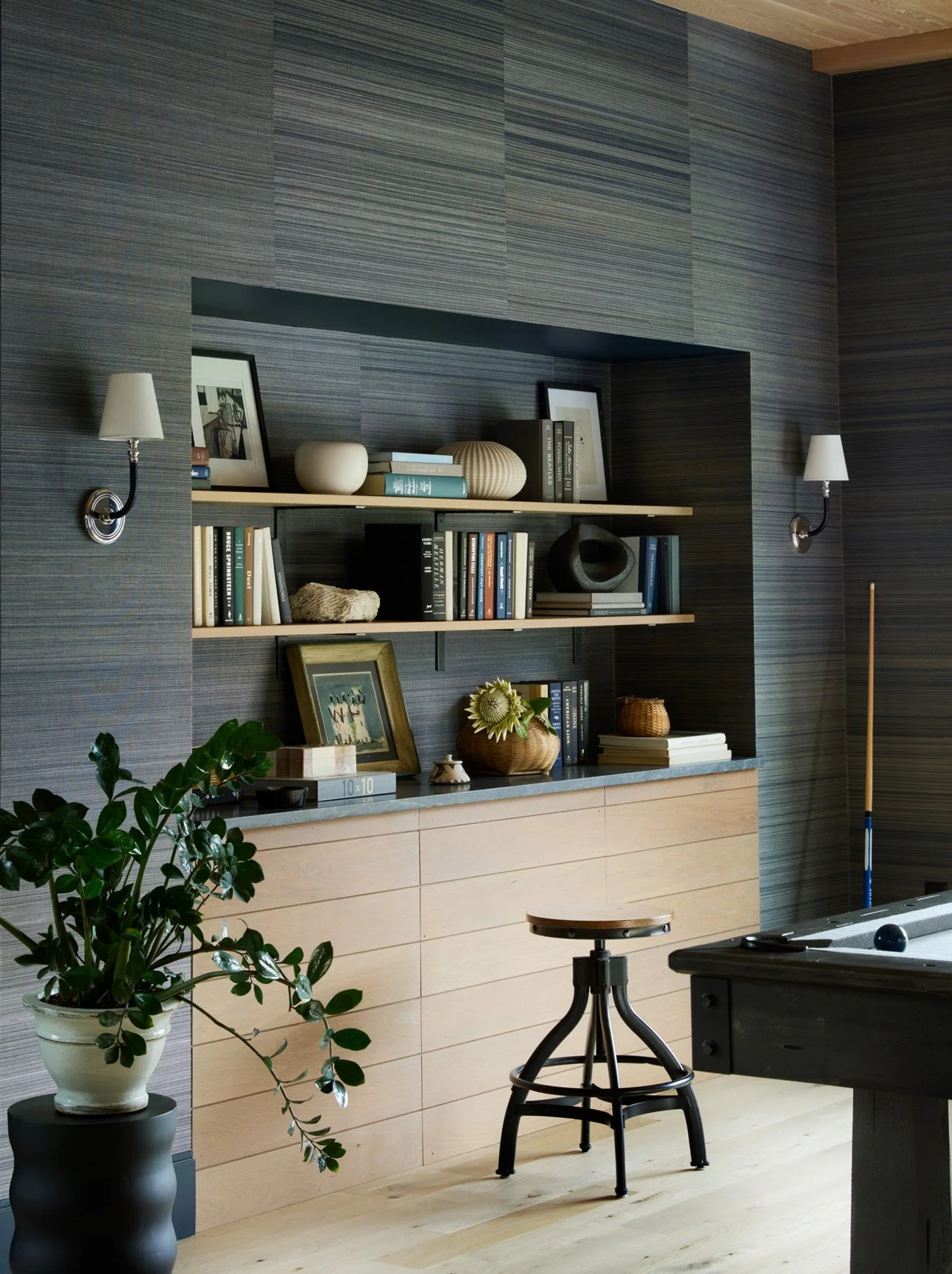 SACRIS built-in shelving with stone counter and concealed access, white oak paneling and grasscloth surround, North Andover Massachusetts