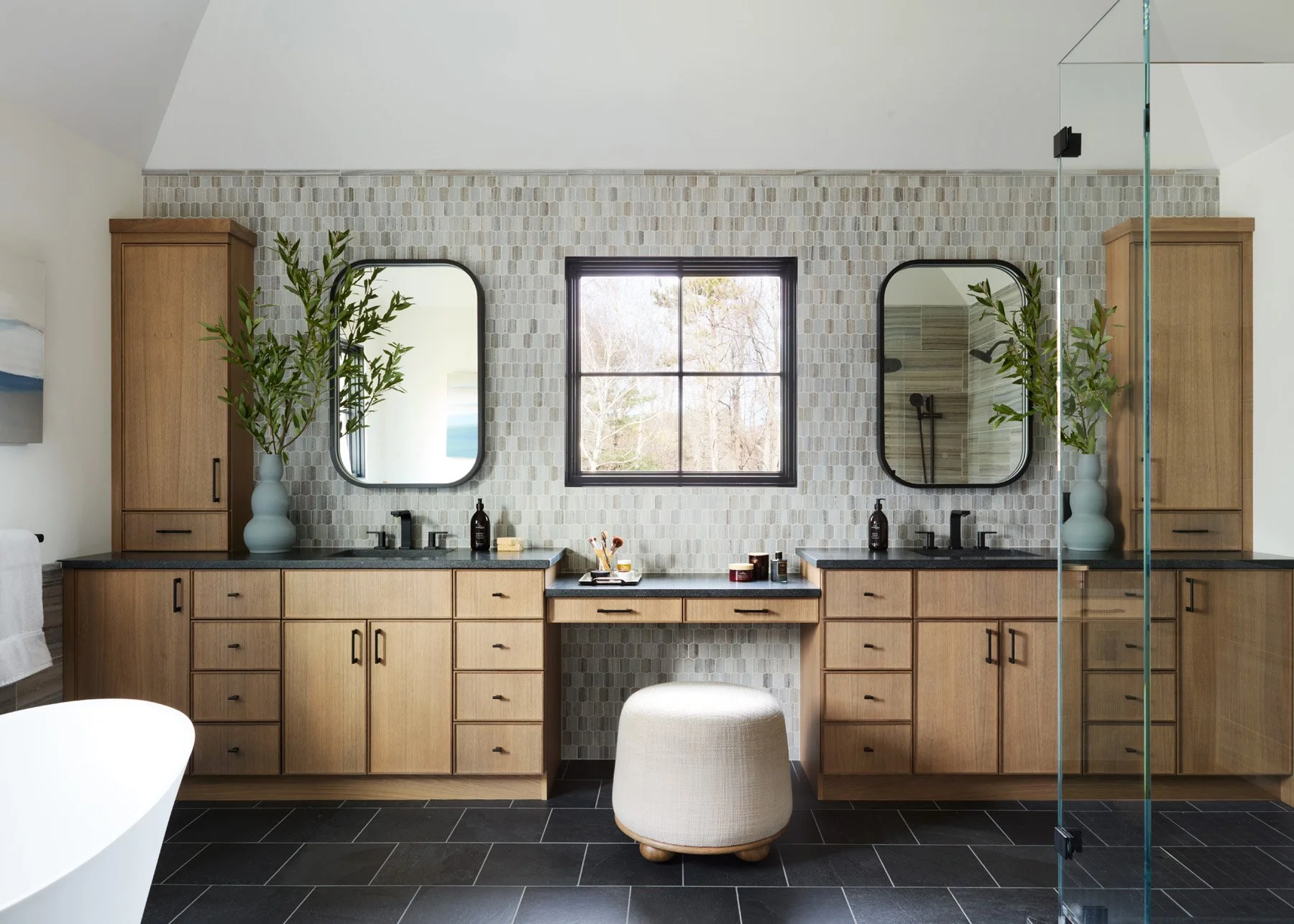 SACRIS primary bath with paired white oak vanities, central makeup station, elongated hexagon blue velvet marble mosaic and honed granite counters, North Andover Massachusetts