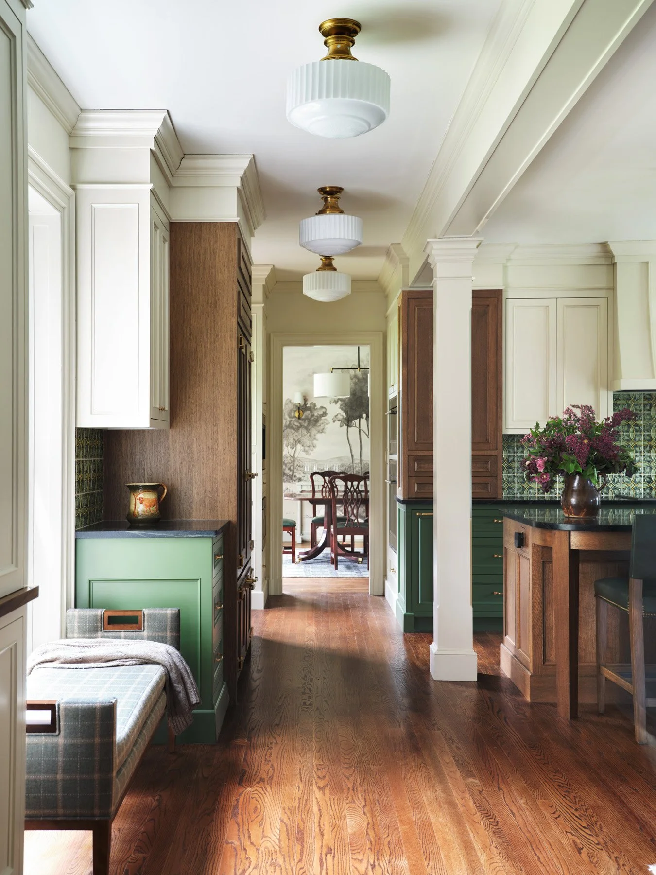 SACRIS view from the kitchen through to the dining room grisaille mural, with milk glass schoolhouse fixtures and plaid upholstered bench, Nashua New Hampshire