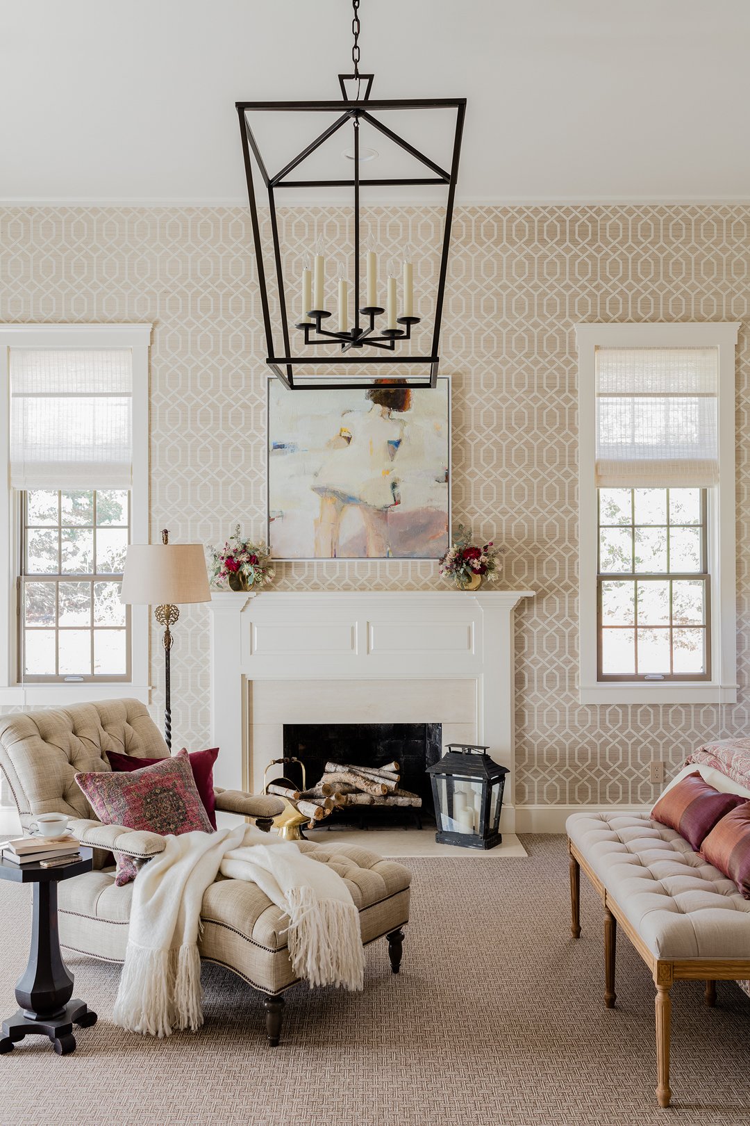 Traditional sitting room with trellis wallpaper, white fireplace mantel, and tufted linen chair — luxury interior design on the North Shore of Massachusetts by Sacris Design