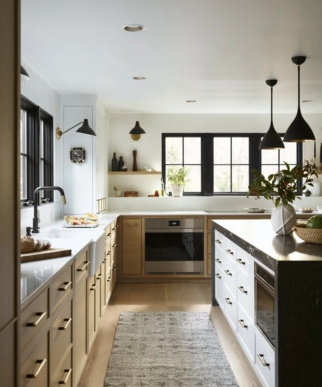 Sacris Design Merrimack Valley kitchen renovation with two-tone oak cabinetry and black waterfall island, North Andover Massachusetts