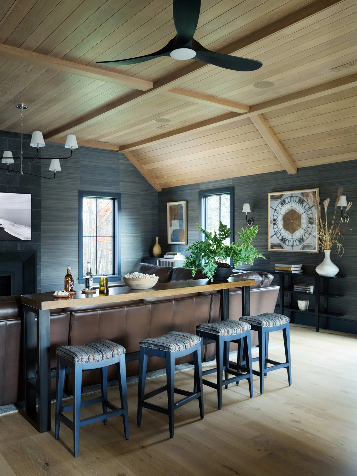SACRIS great room with bar-height counter behind the sectional, Woodbridge counter stools and vaulted white oak ceiling, North Andover Massachusetts