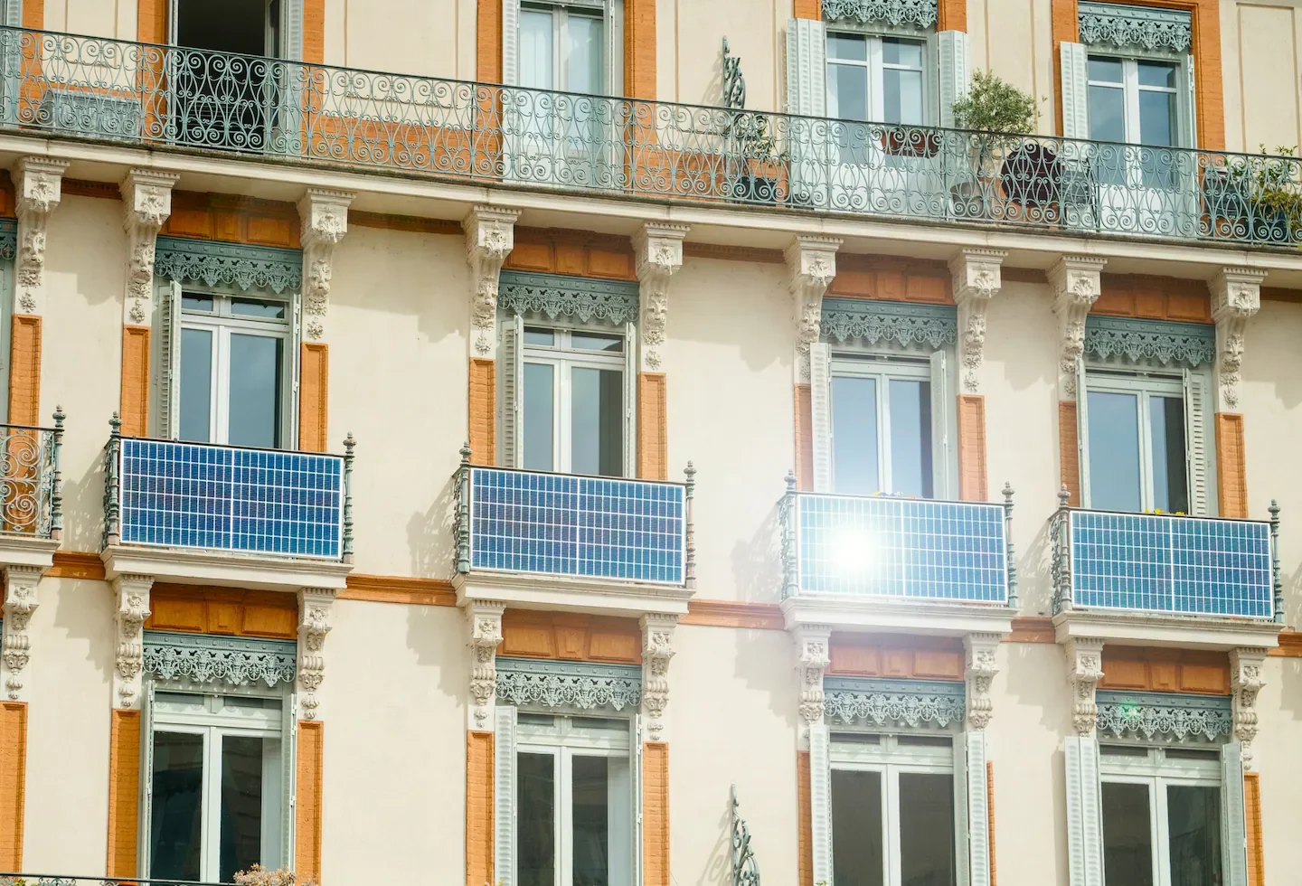 Solar panels installed on the balconies of an apartment building. (iStock)