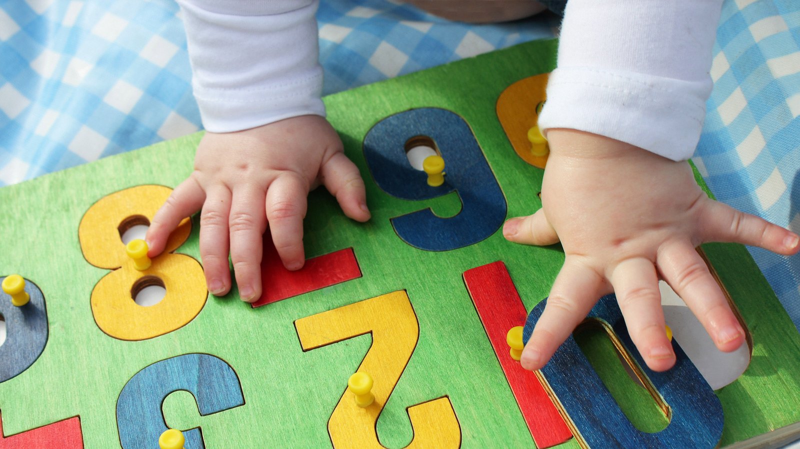 toddler playing with puzzle