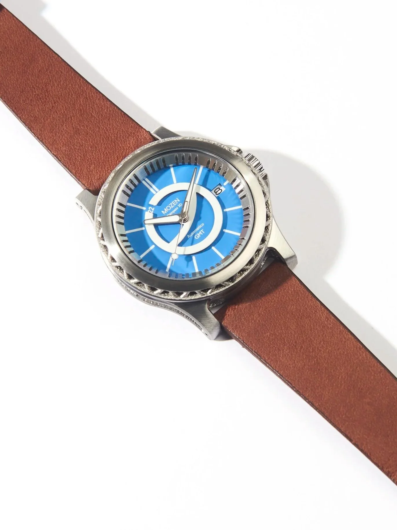 A wristwatch with a blue dial, white and black markings, and a brown leather strap on a white background.