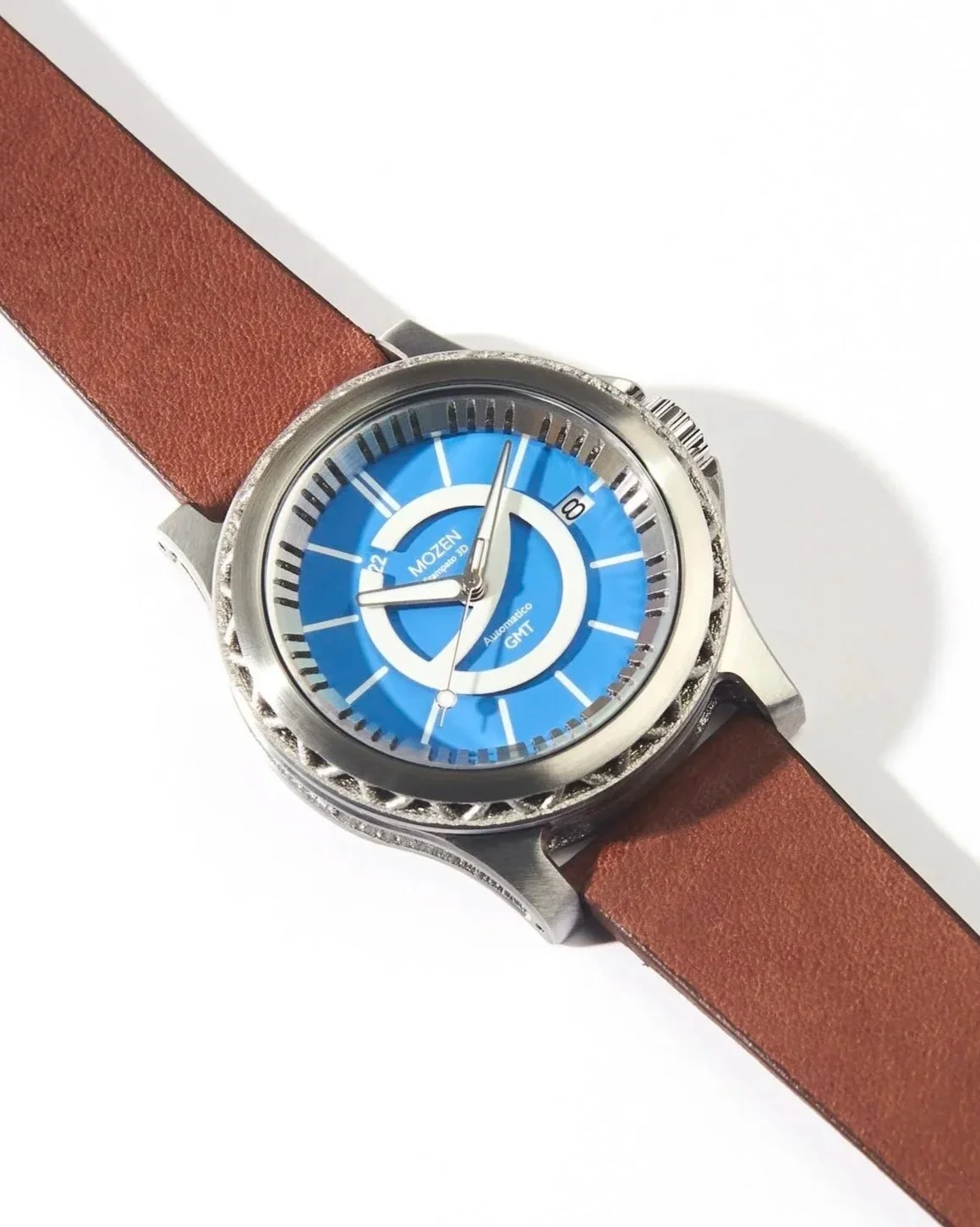 A wristwatch with a blue dial, silver case, and brown leather strap, displaying the time and date.
