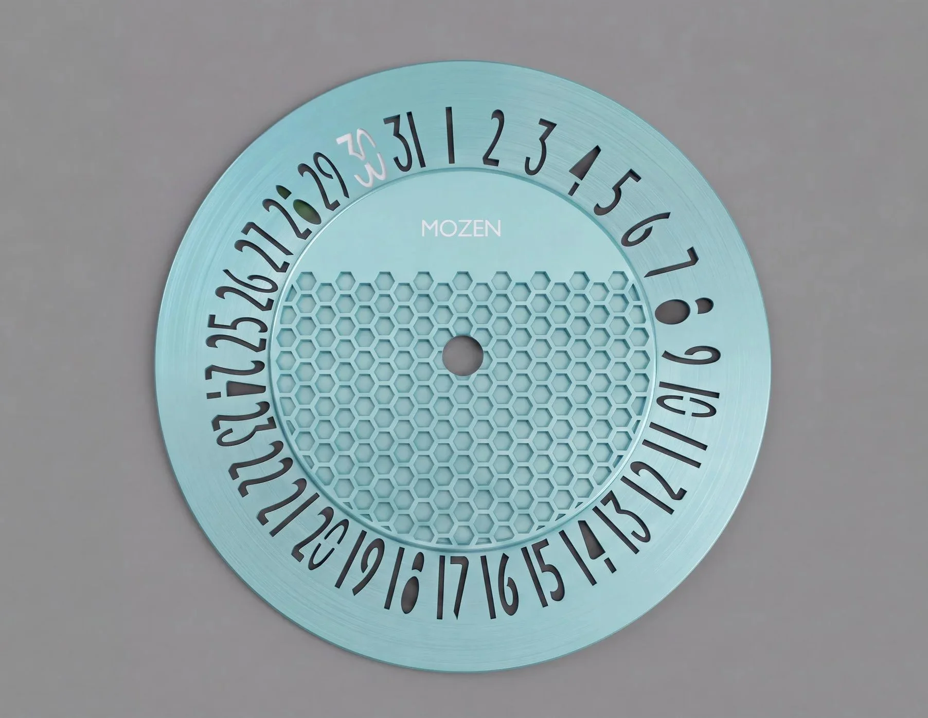 A light blue circular countdown timer with black numbers from 1 to 31 around the edge and a honeycomb pattern in the center, with the word 'MOZEN' in the middle.