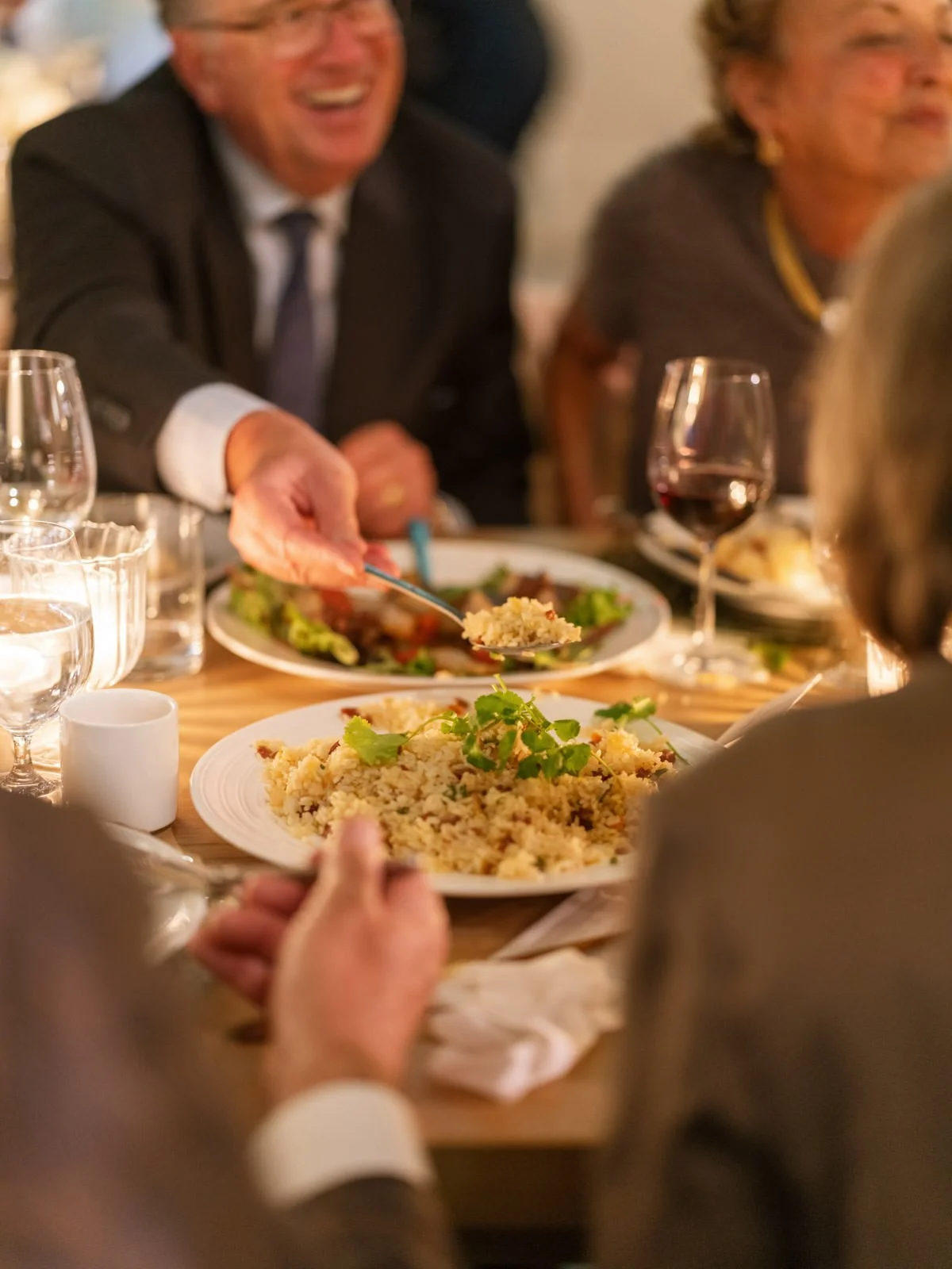 Guests eating at family style Chinese dinner wedding reception at Cache Estate in Indio, CA, by Palm Springs wedding planner COJ Events
