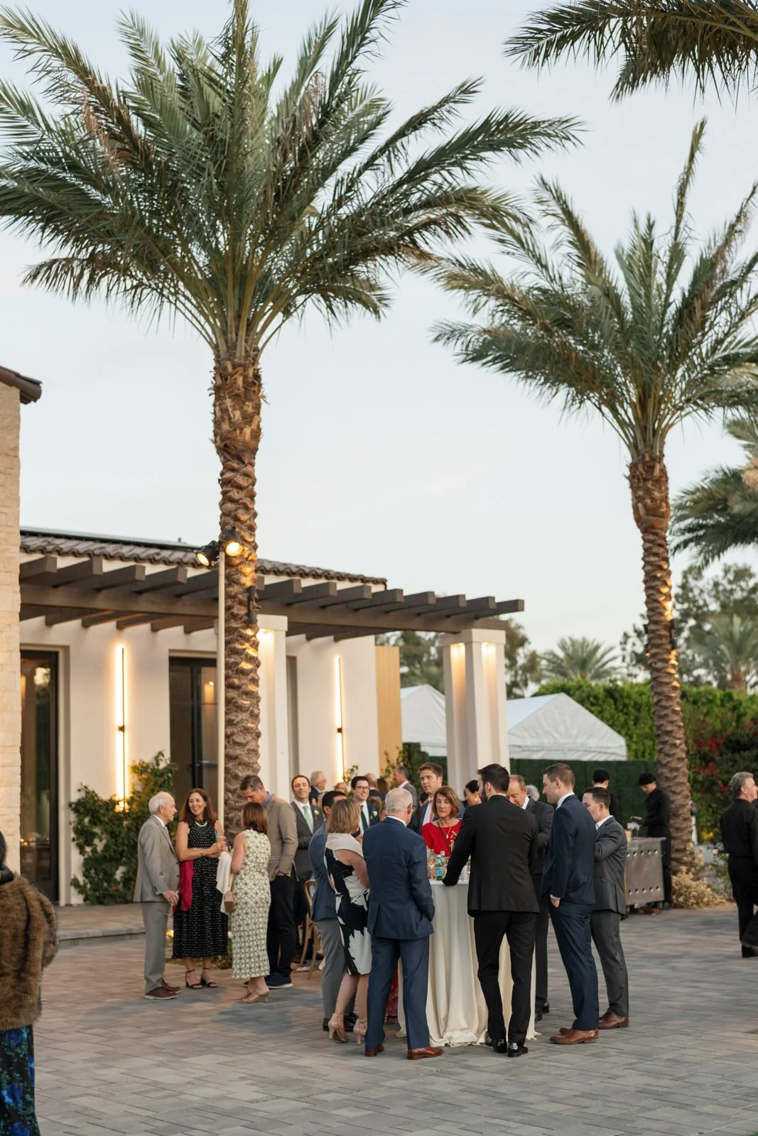 Guests during sunny cocktail hour at Cache Estate Wedding in Indio, CA, by Palm Springs wedding planner COJ Events