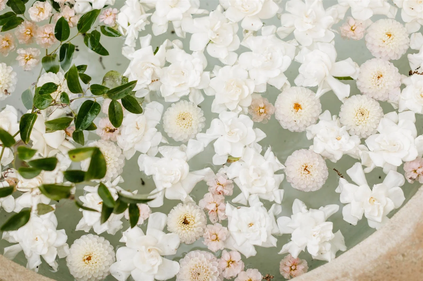 Floating white florals in a decorative planter-Designed by COJ Events-Palm Springs Destination Wedding
