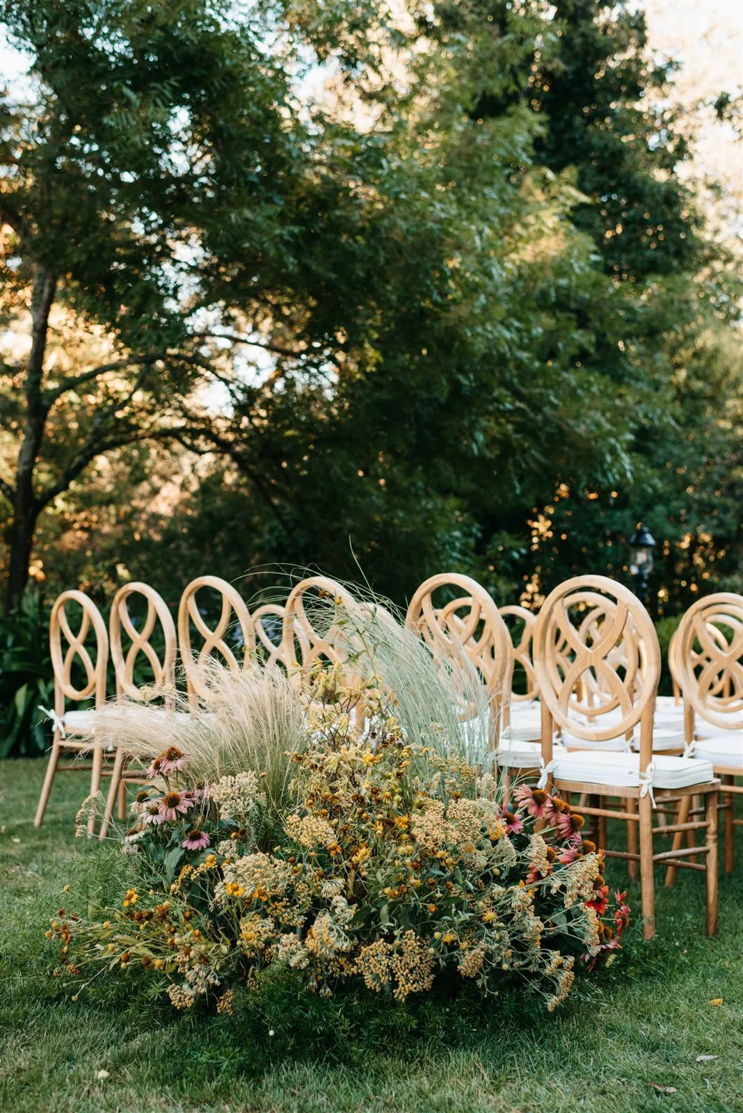 Large florals of purple coneflower, white hydrangeas and grasses with a woodland vibe on the grounds of The Madrona -Planned by COJ Events-Palm Springs Destination Wedding