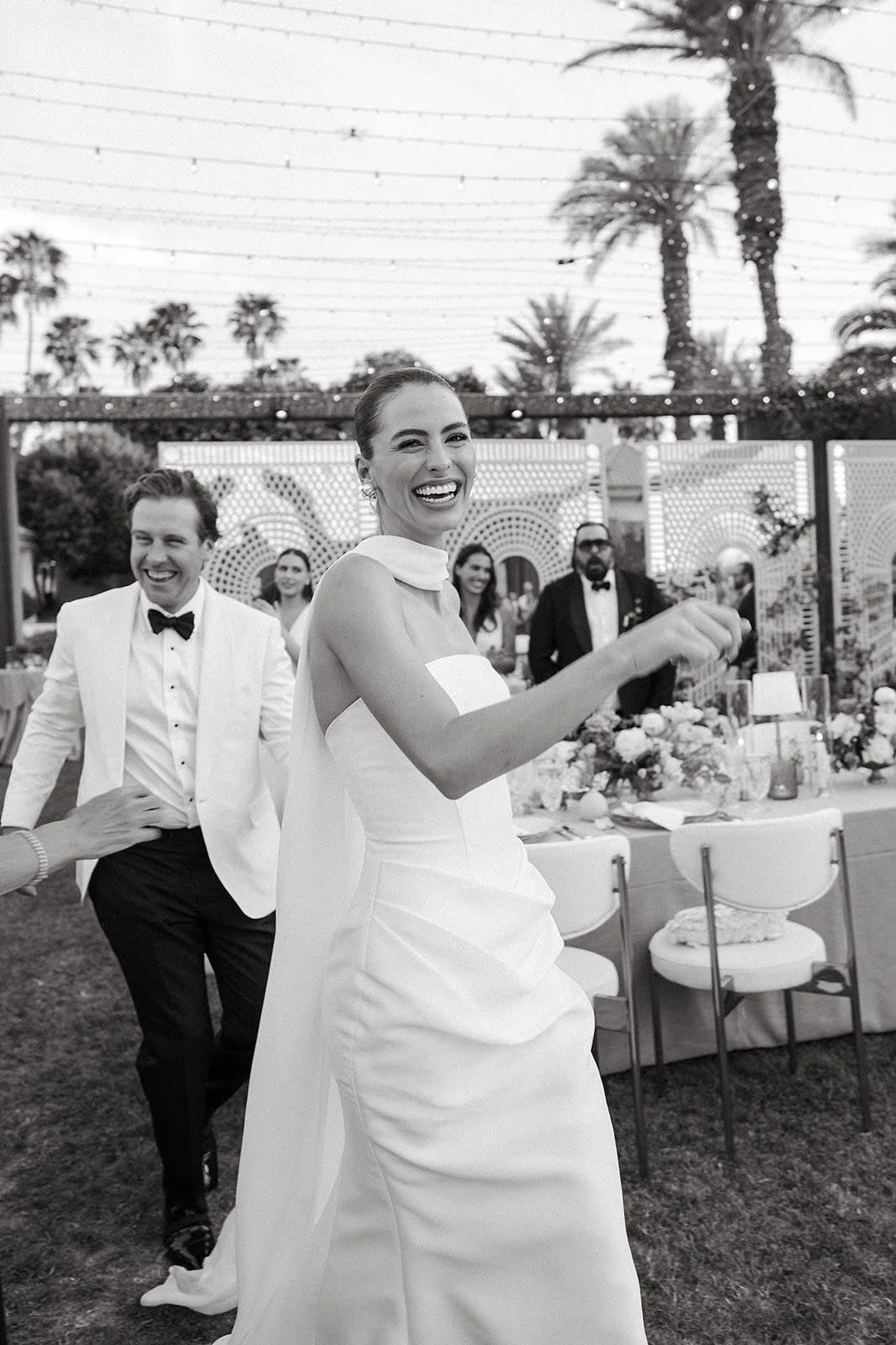 Gorgeous bride and groom arriving at their Merv Griffin Estate wedding reception designed by COJ Events