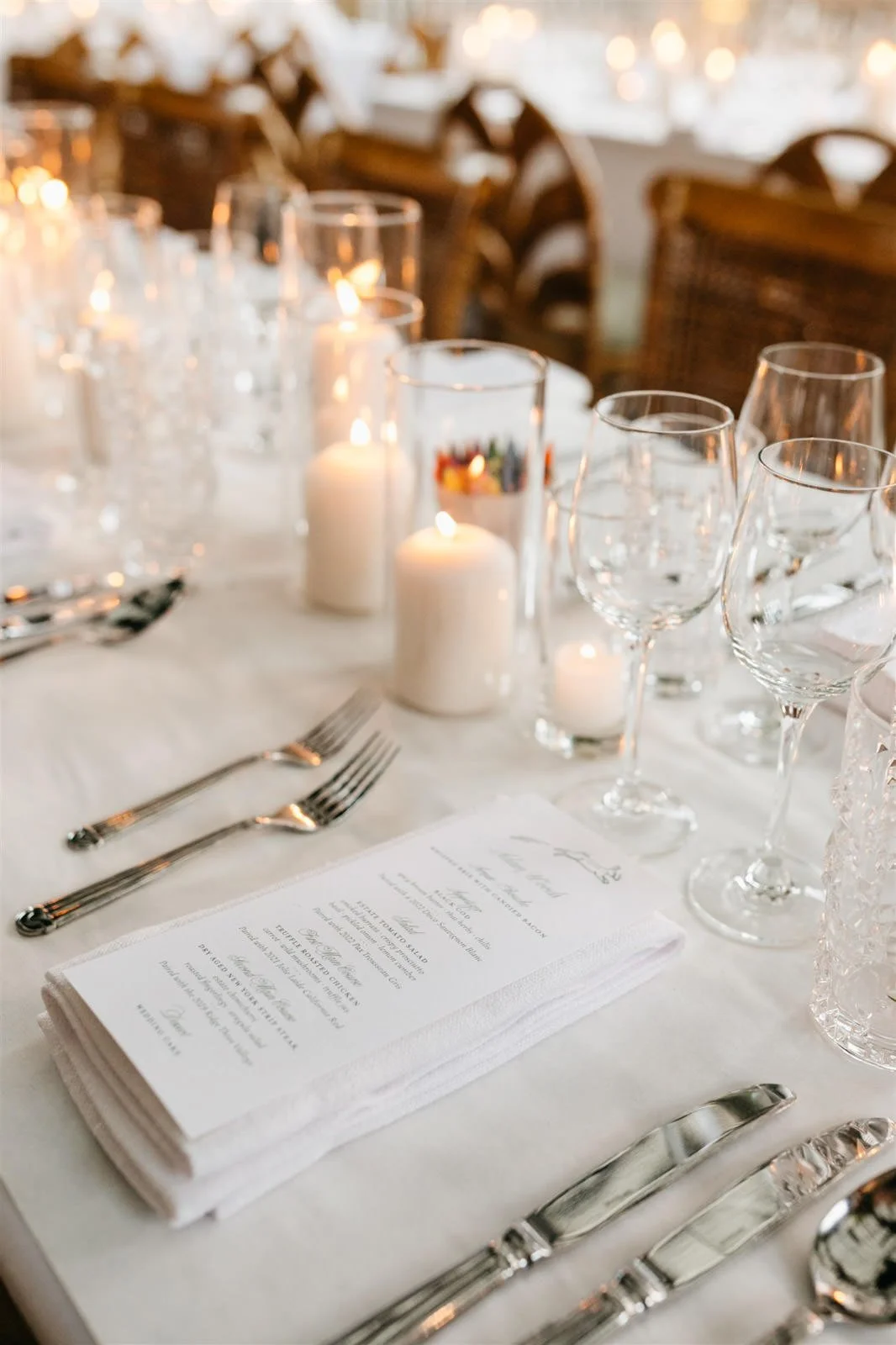 Couple's custom dinner menu on candlelit reception tables with white linens-Planned by COJ Events-Palm Springs Destination Wedding