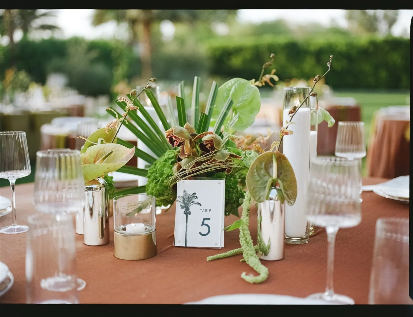 Outdoor dining table decor at a Cache Estate wedding reception in Indio, CA, by Palm Springs wedding planner COJ Events