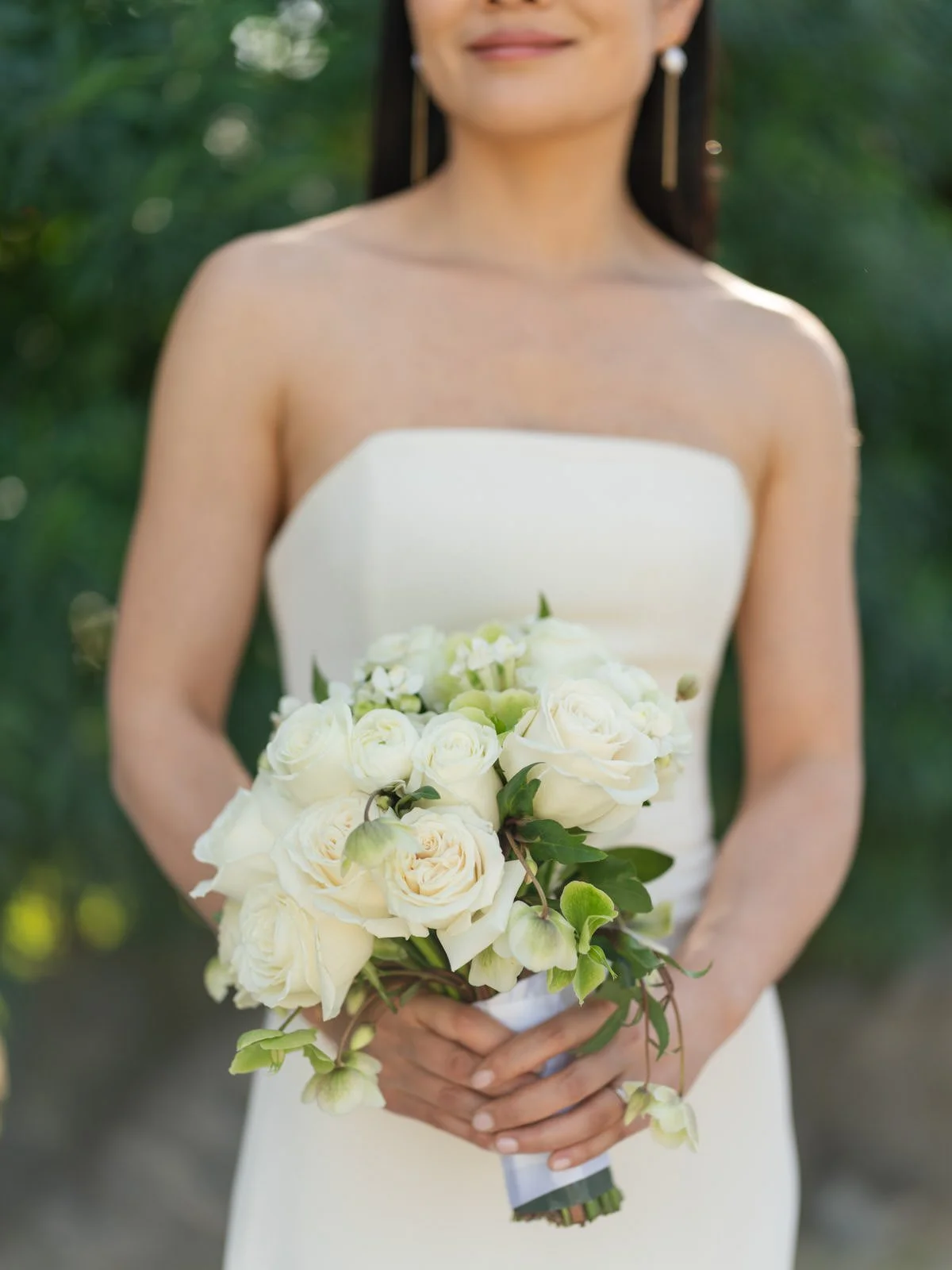 Bride with a white wedding bouquet at Cache Estate Wedding in Indio, CA, by Palm Springs wedding planner COJ Events