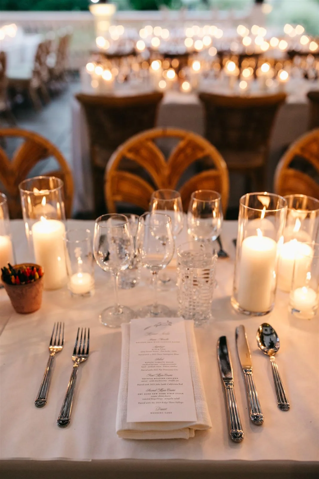 Couple's custom dinner menu on candlelit reception tables with white linens-Planned by COJ Events-Palm Springs Destination Wedding