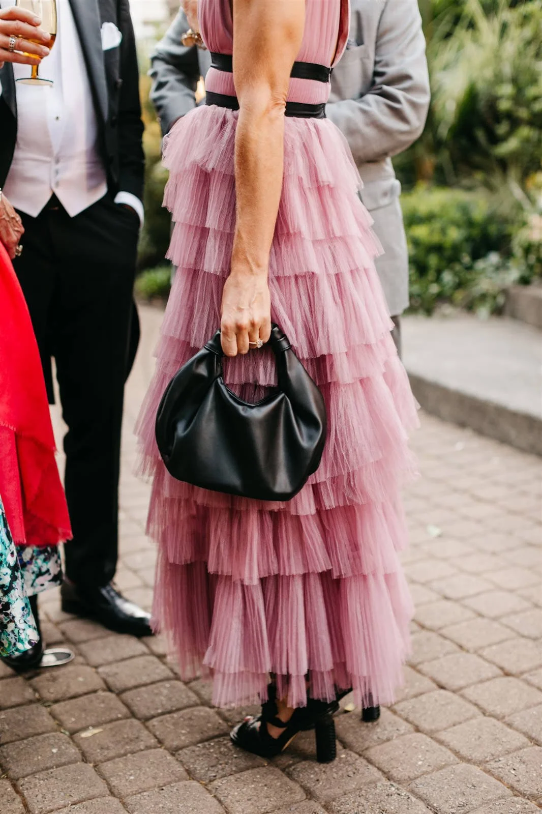 Guests' pretty rose pink layered dress on the grounds of The Madrona -Planned by COJ Events-Palm Springs Destination Wedding