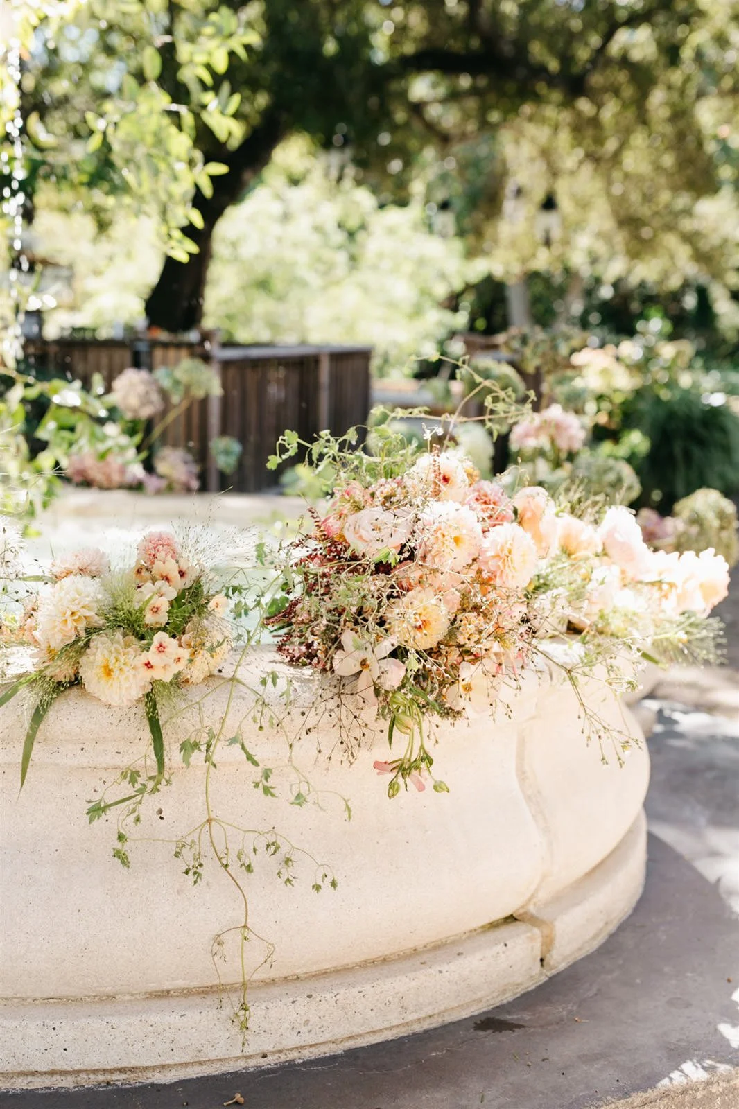 Bridal party's bouquets of subtle warm-colored roses with a woodland vibe on the grounds of The Madrona -Planned by COJ Events-Palm Springs Destination Wedding
