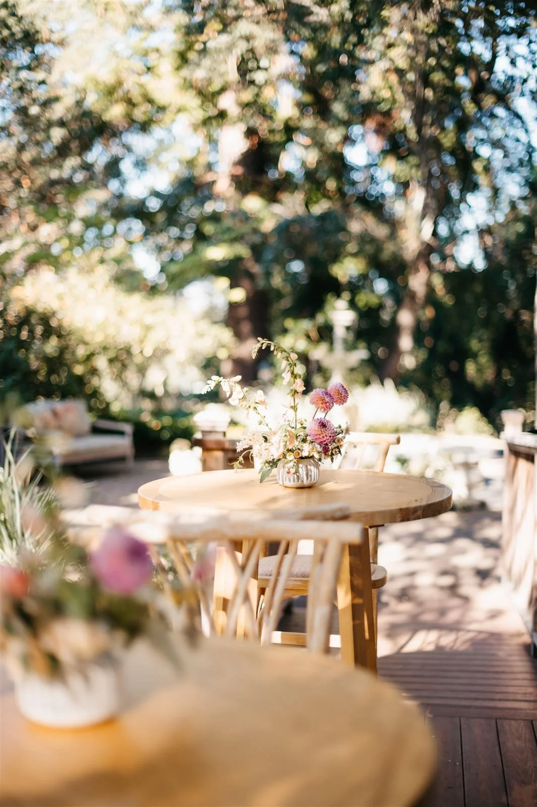 Woodland vibe florals on cocktail hour tables on the grounds of The Madrona -Planned by COJ Events-Palm Springs Destination Wedding