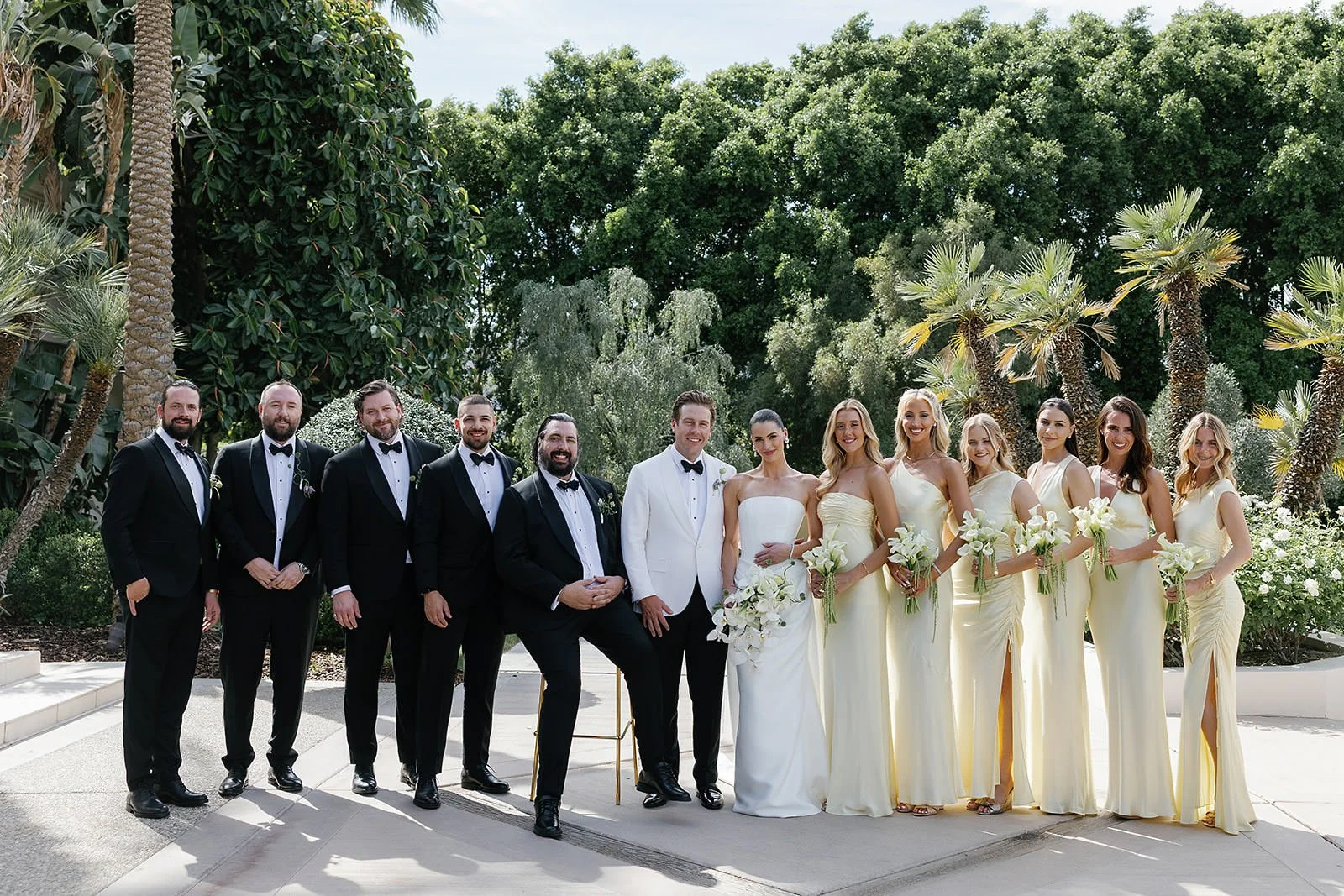Wedding party portrait with bridesmaids in yellow dresses a Merv Griffin Estate wedding designed by COJ Events