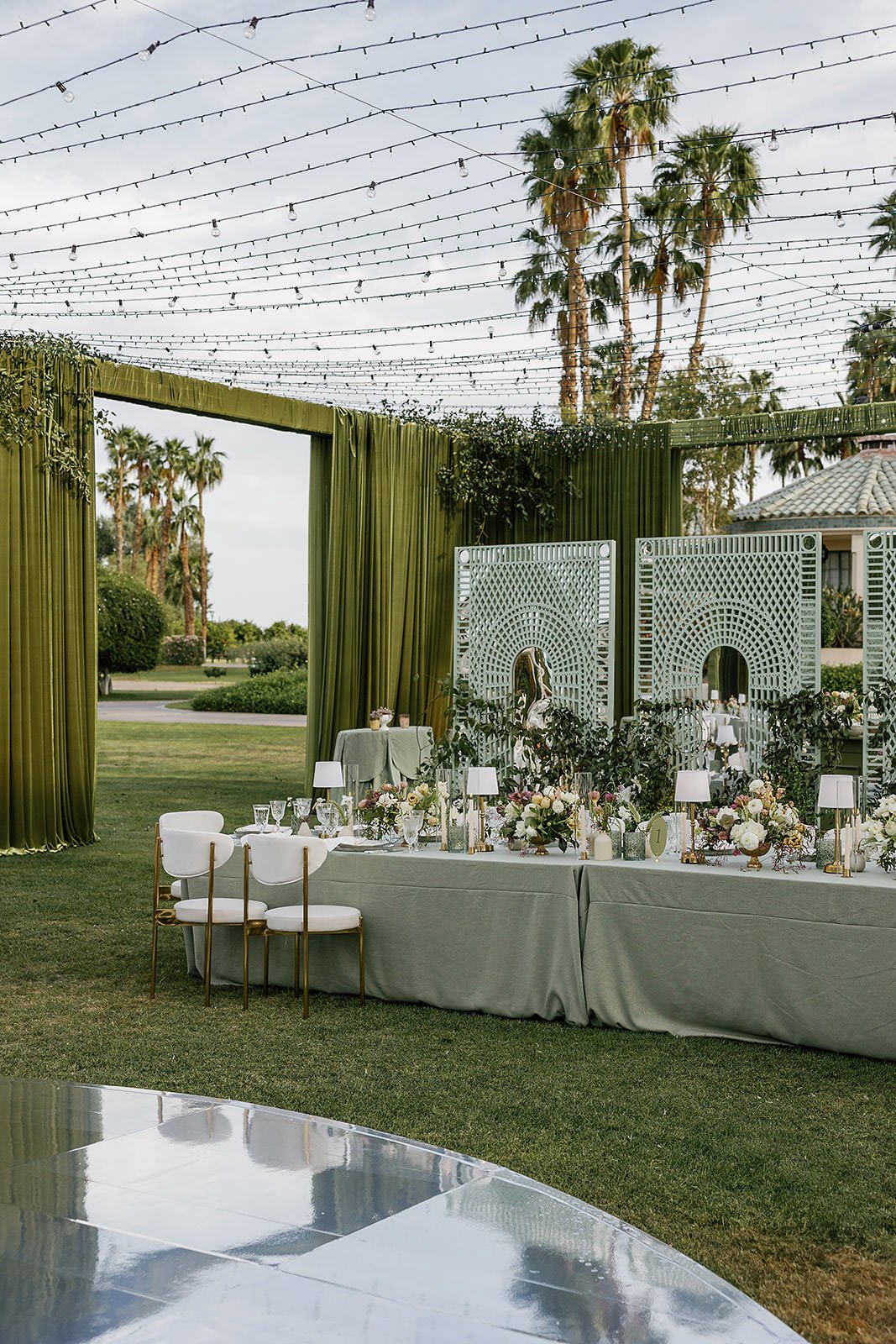 A Merv Griffin Estate wedding reception with outdoor green garden party decor designed by COJ Events