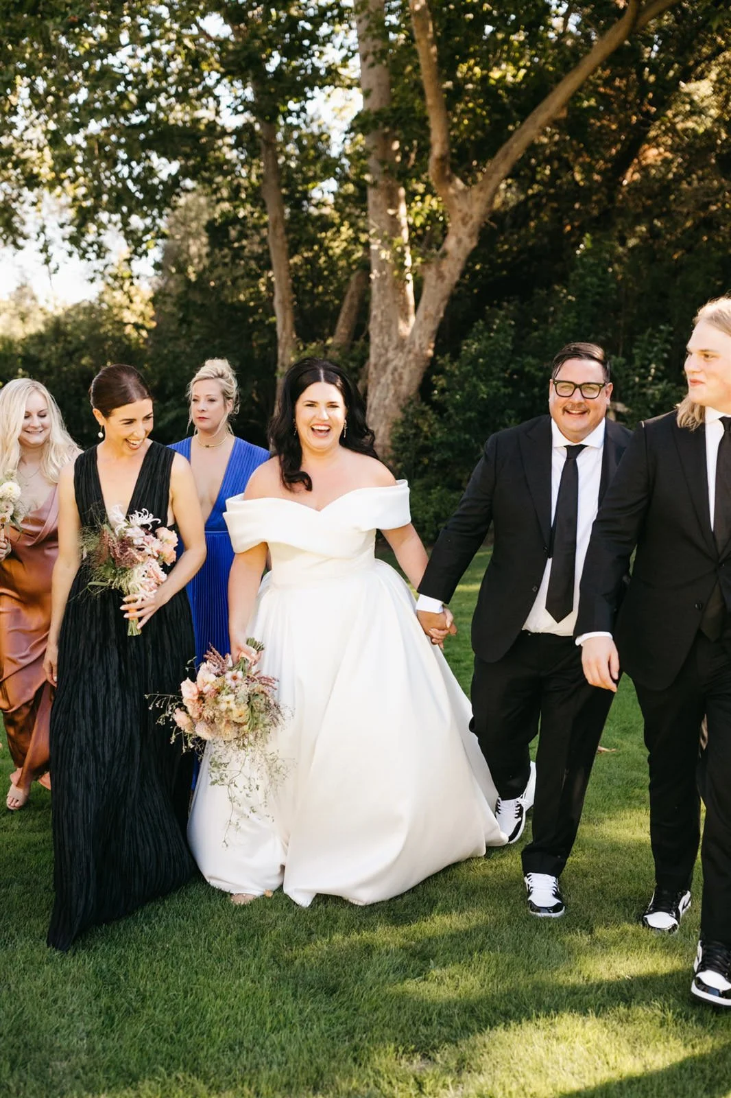 Bride and groom leaving the ceremony after becoming husband and wife on the grounds of The Madrona -Planned by COJ Events-Palm Springs Destination Wedding