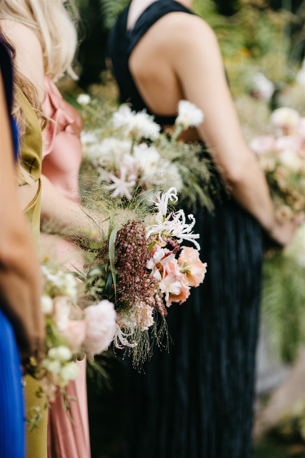 Bridesmaids bouquets of subtle warm-colored roses with a woodland vibe on the grounds of The Madrona -Planned by COJ Events-Palm Springs Destination Wedding