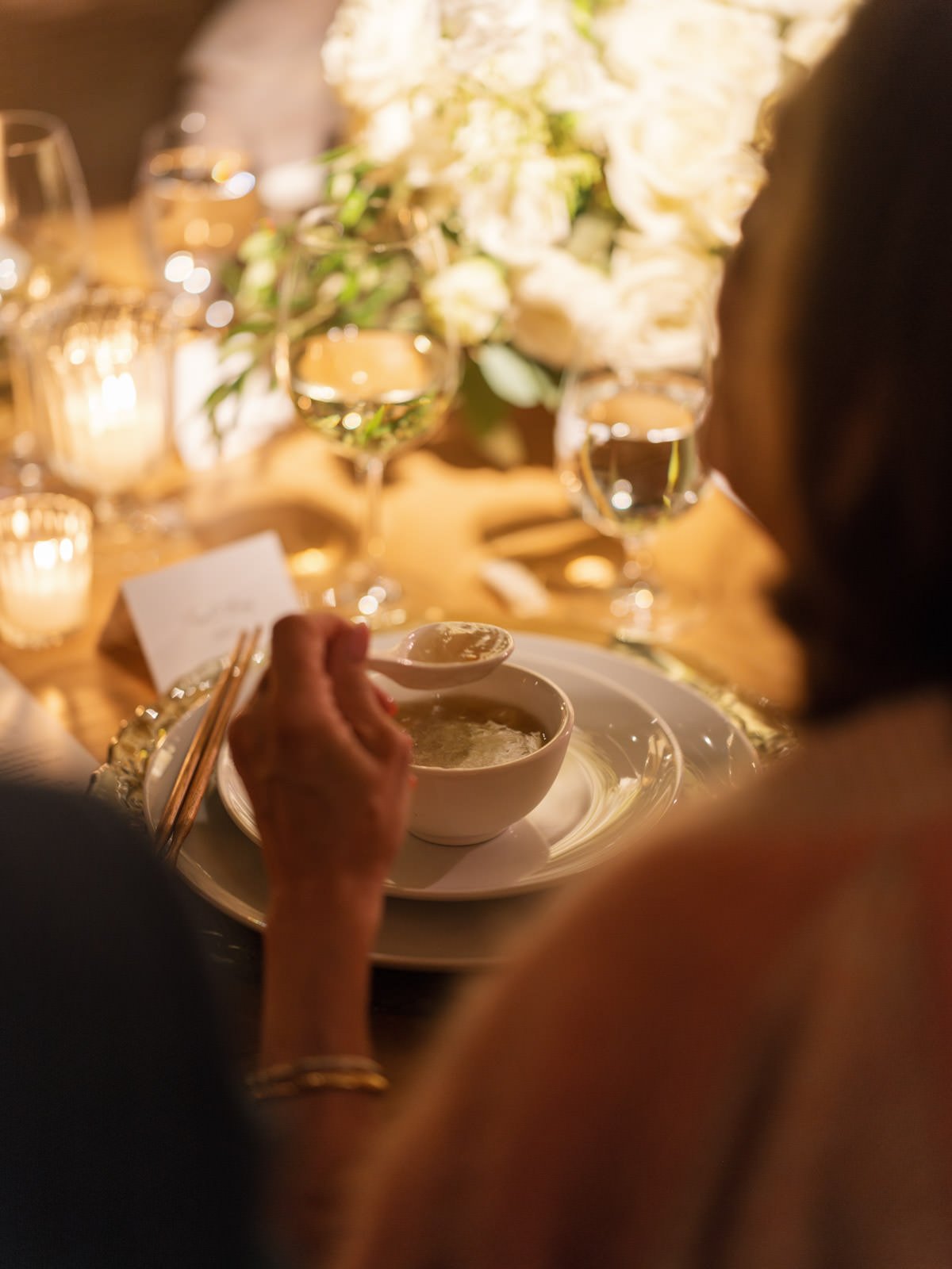 Guests eating at family style Chinese dinner wedding reception at Cache Estate in Indio, CA, by Palm Springs wedding planner COJ Events