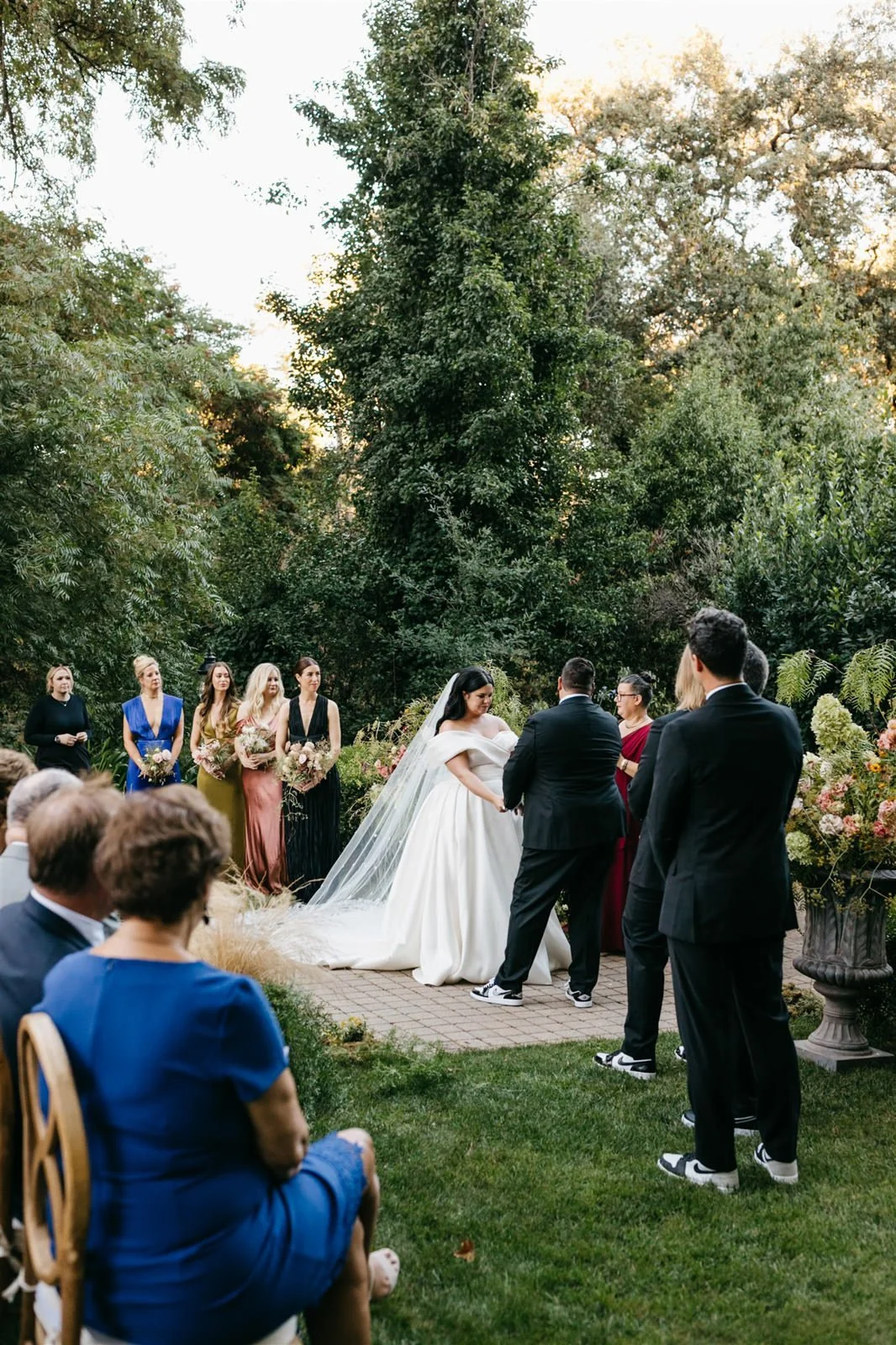 Couple exchanging vows on the grounds of The Madrona -Planned by COJ Events-Palm Springs Destination Wedding