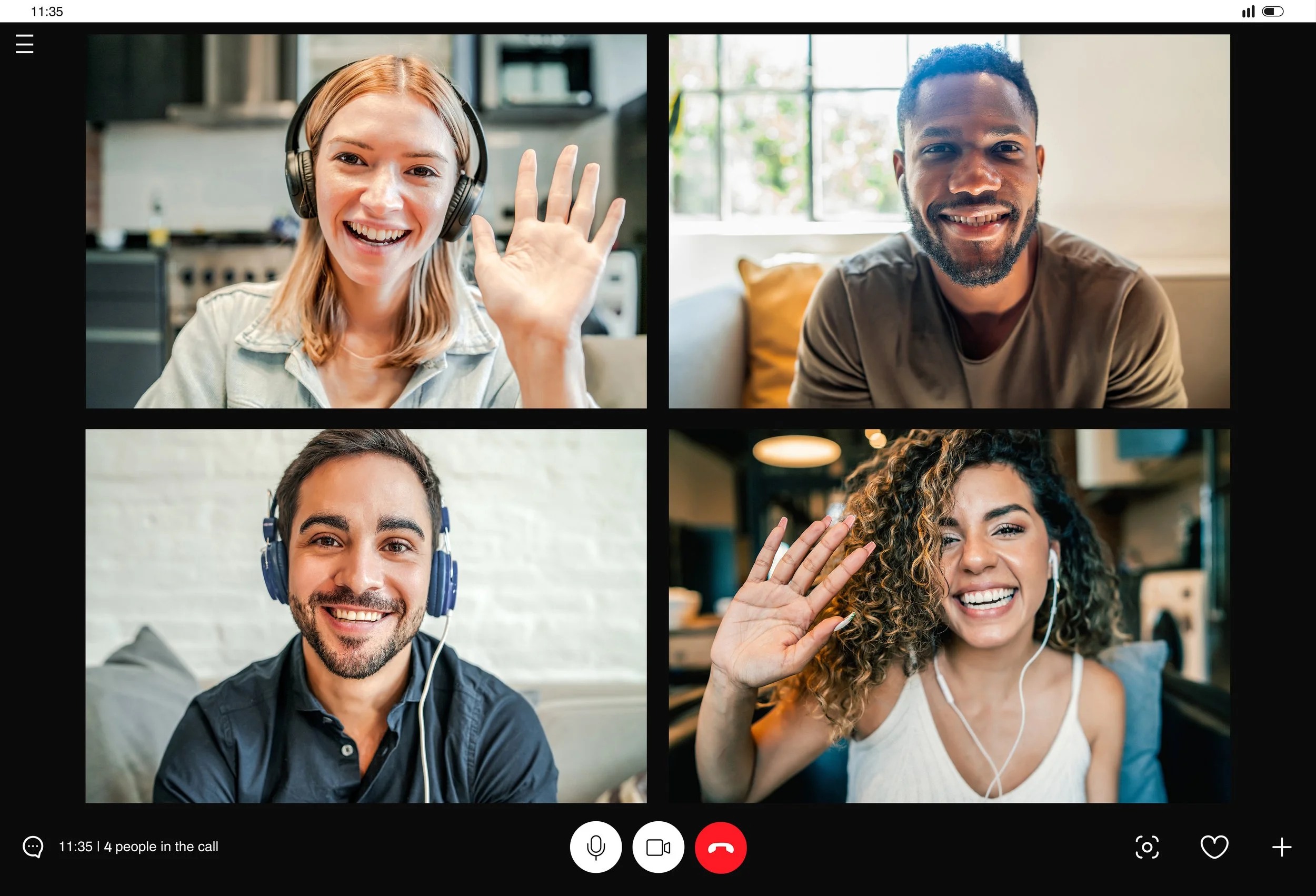 Screenshot of a virtual video call with four smiling people, two men and two women, waving and looking at the camera.