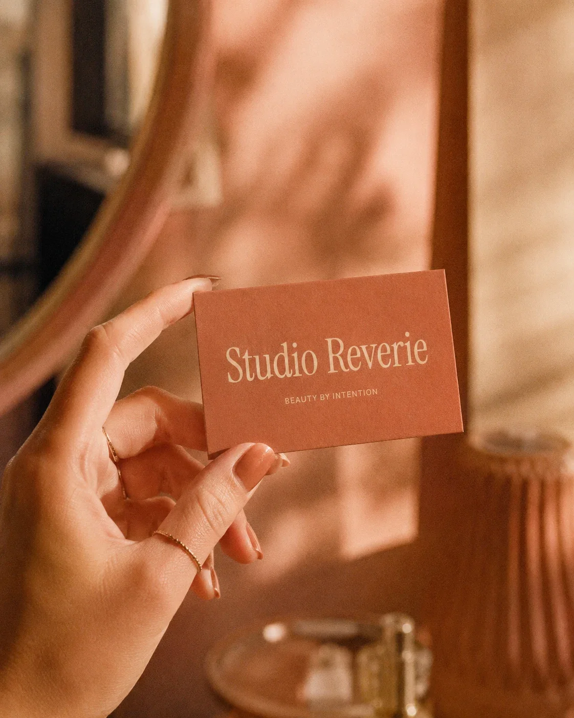 Editorial hand-held business card mockup for a beauty by intention branding studio