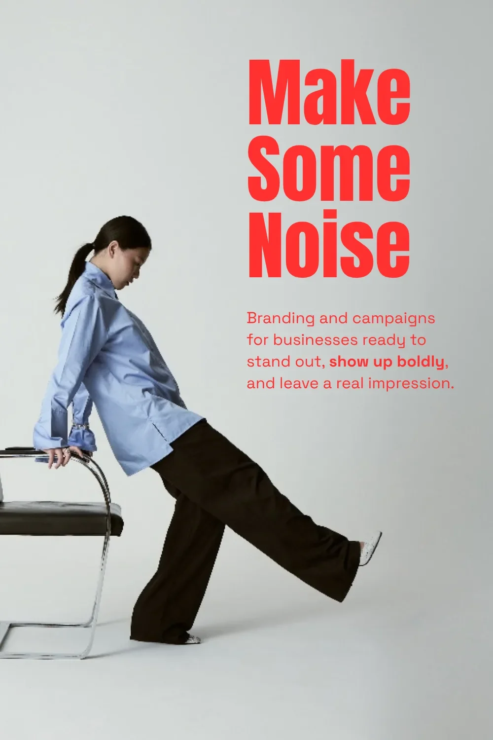 High-impact red Anton heading and Space Grotesk text beside a woman leaning on a chrome chair