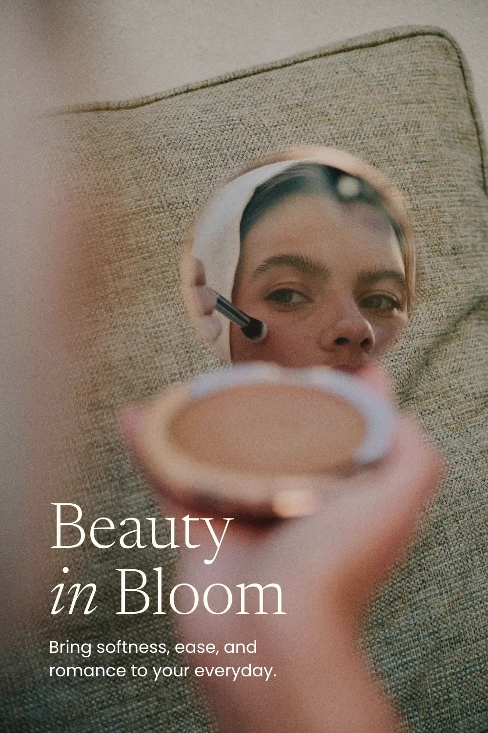 Feminine Google font pairing of Newsreader Light and Poppins over a woman in a compact mirror