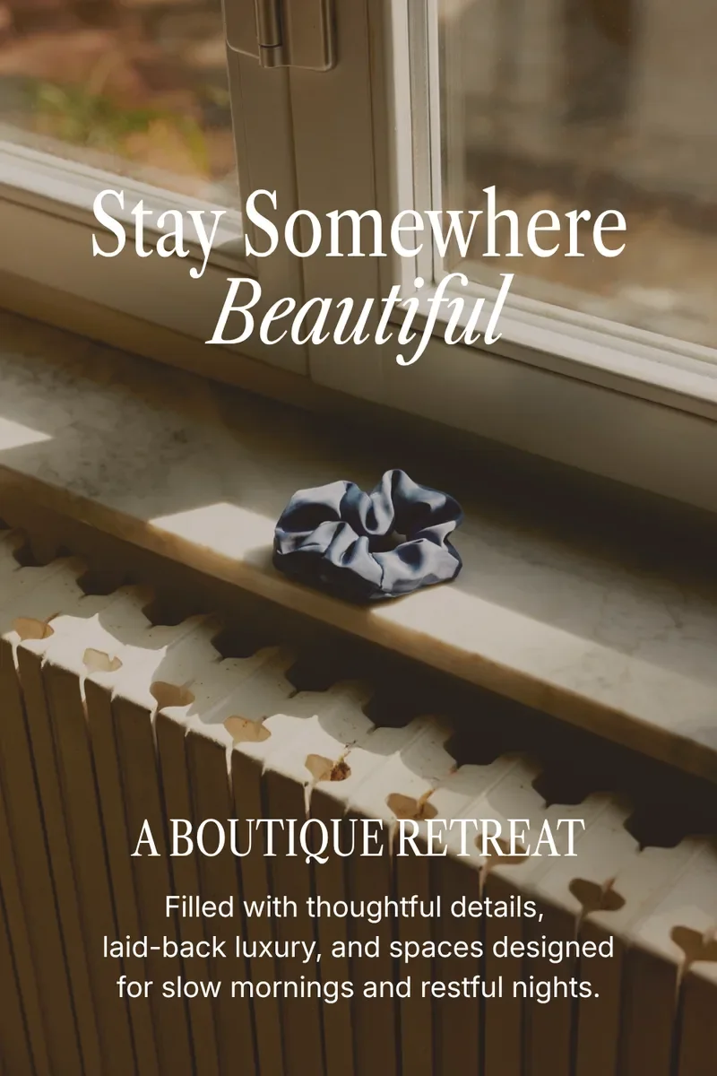 Silk scrunchie on a sunlit windowsill with a serif headline reading Stay Somewhere Beautiful