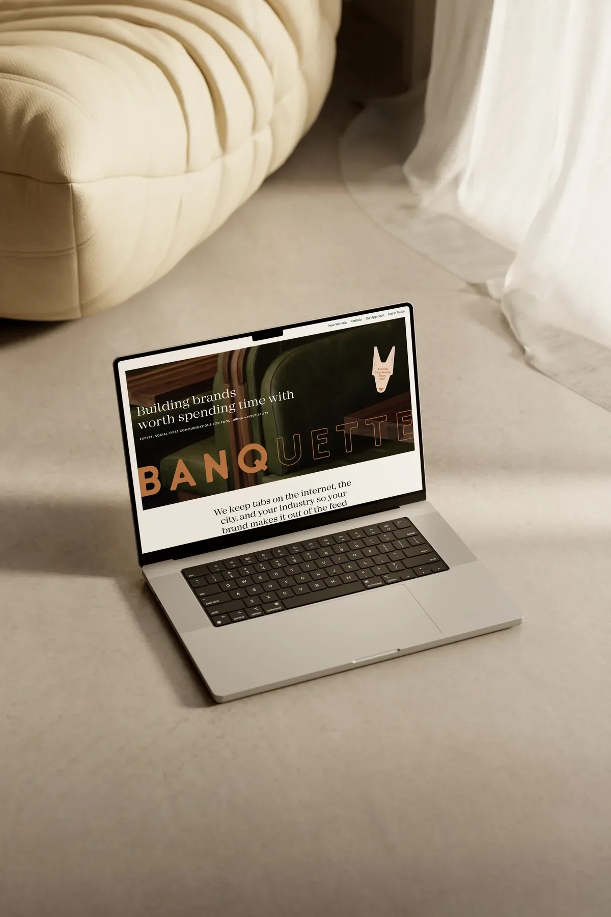 Laptop mockup of the Banquette homepage hero, a custom website design for a Toronto marketing agency