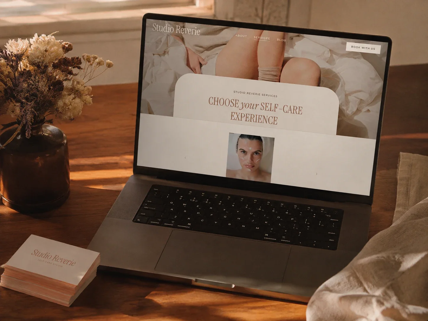 Laptop mockup of a feminine spa website services page inviting visitors to choose their self-care experience