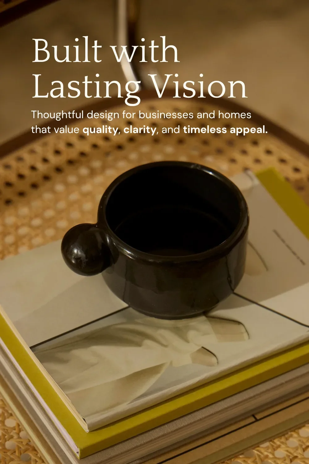 Quattrocento heading and DM Sans paragraph font pairing over a black mug on books and a cane chair