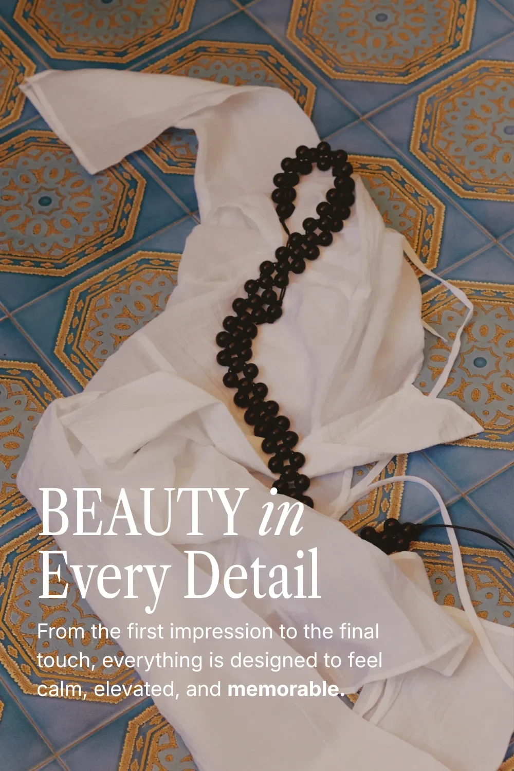 Elegant Google font pairing of Libre Caslon Condensed and Inter over white linen and black beads on blue tiles
