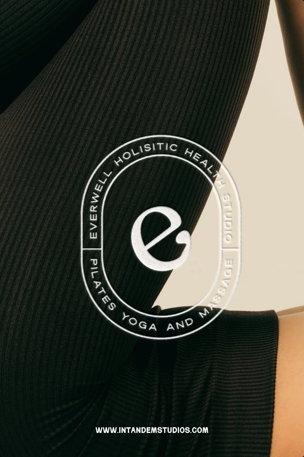 mockup of a stamp logo mark for a coastal casual brand kit on top of someone doing yoga