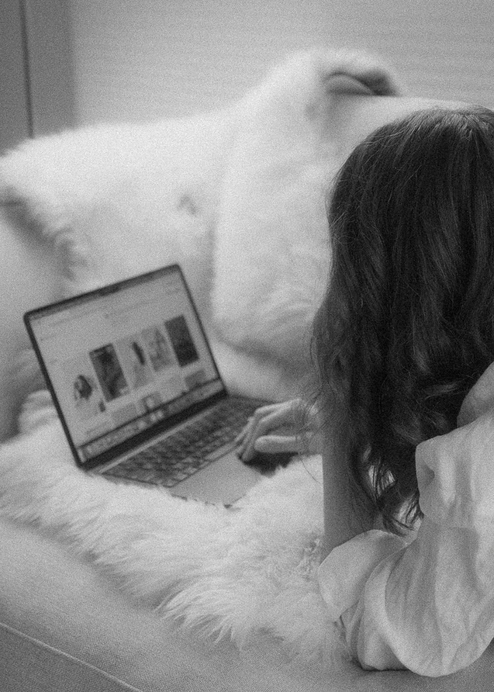 black and white close up of website design edmonton co-founder samara bortz working on her computer