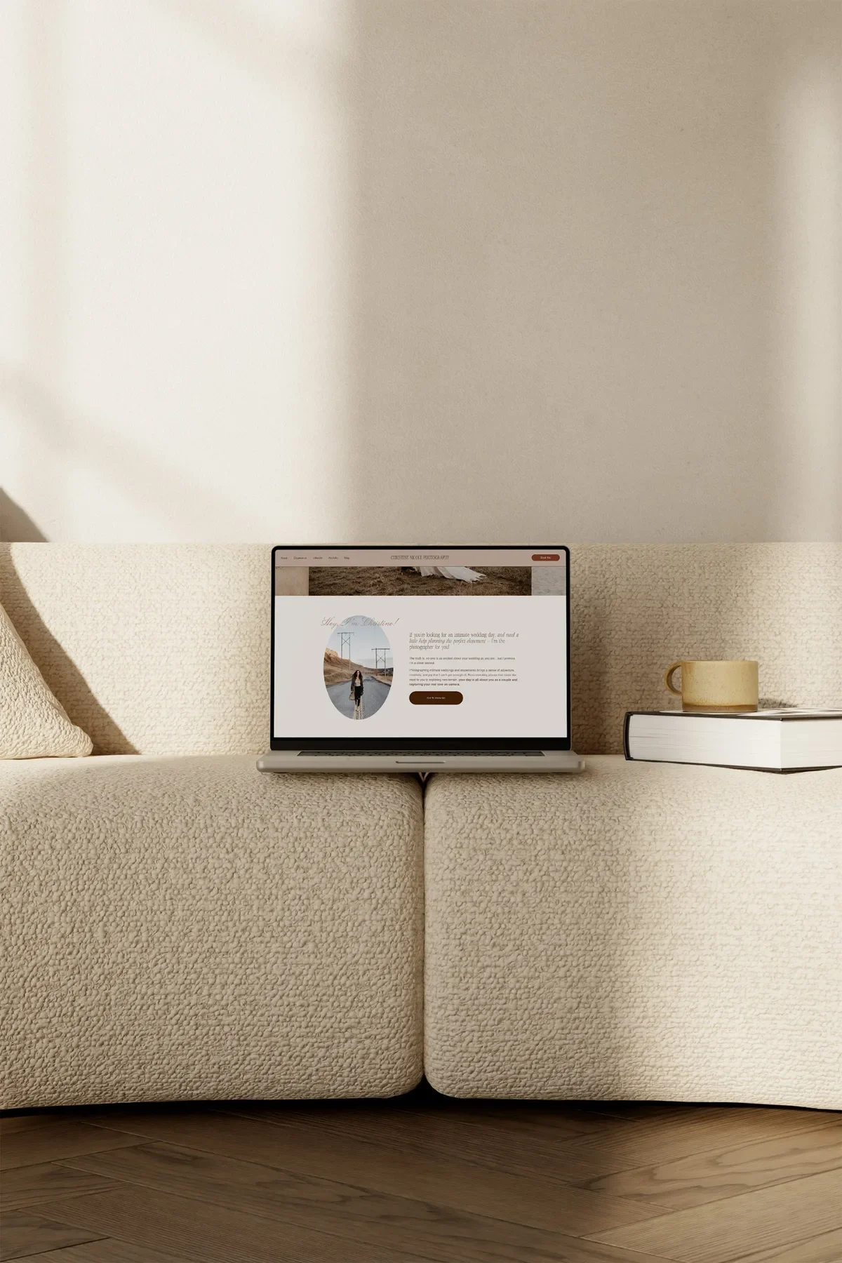 Christine Nicole Photography’s website redesign on a laptop, with an oval portrait on a desert road