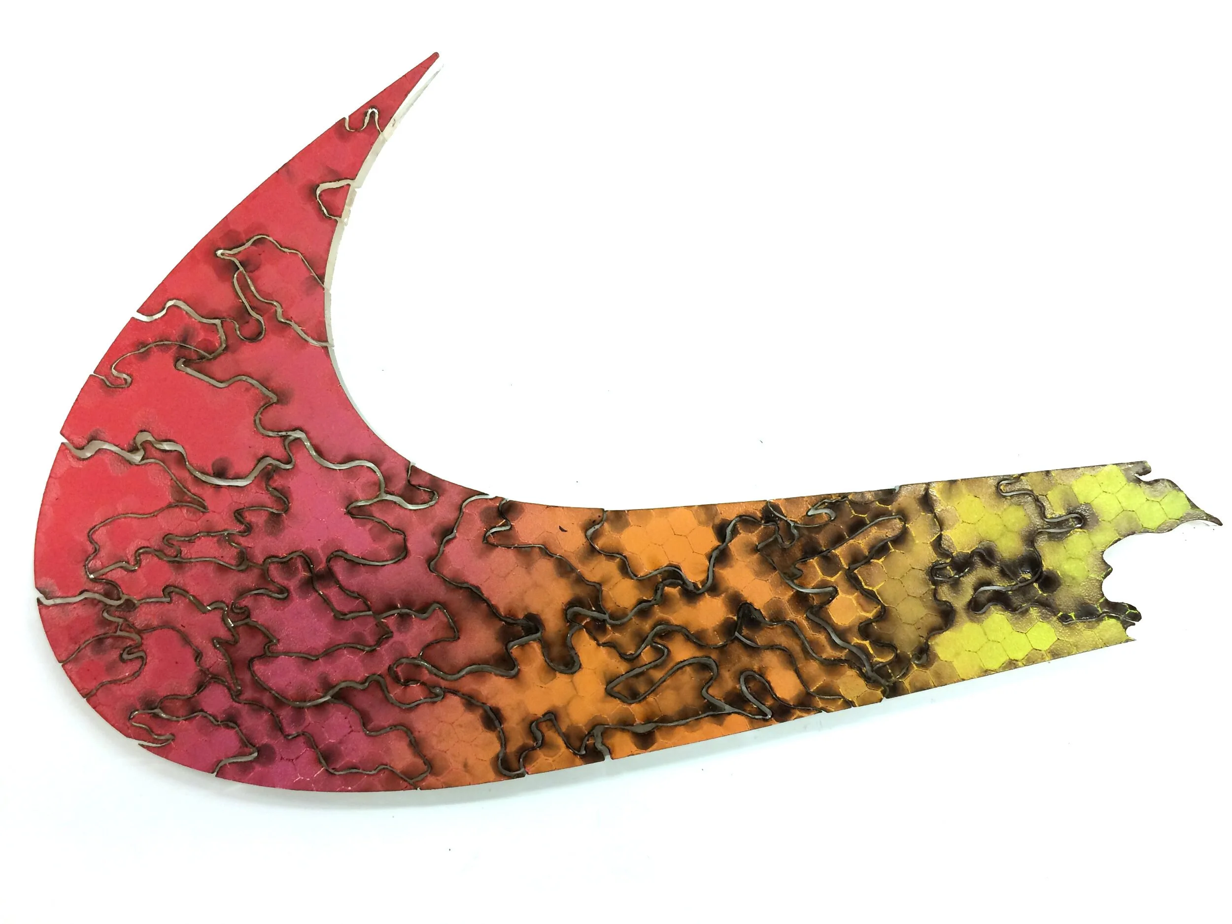 Red orange and yellow nike swoosh acrylic puzzle by Artist Brian Madden on white background