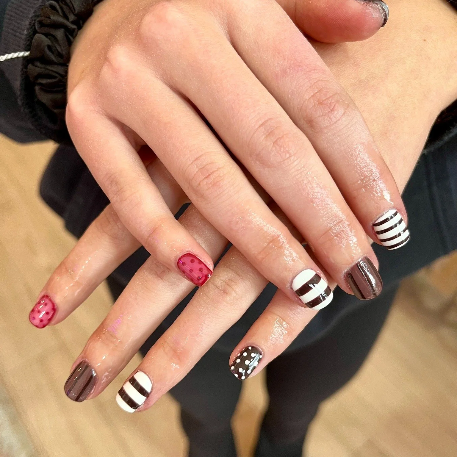 Festive, fun, and perfectly mismatched. Just how we like it. 🤎❤️// Tier 3 nail art by @nailsbysophcall 

Polished Hamilton is open Tuesday-Saturday from 10-7pm and Sunday 10-4! Book online @ polishedhamilton.com 

#nailsdesign #nailtechs #nailtech #