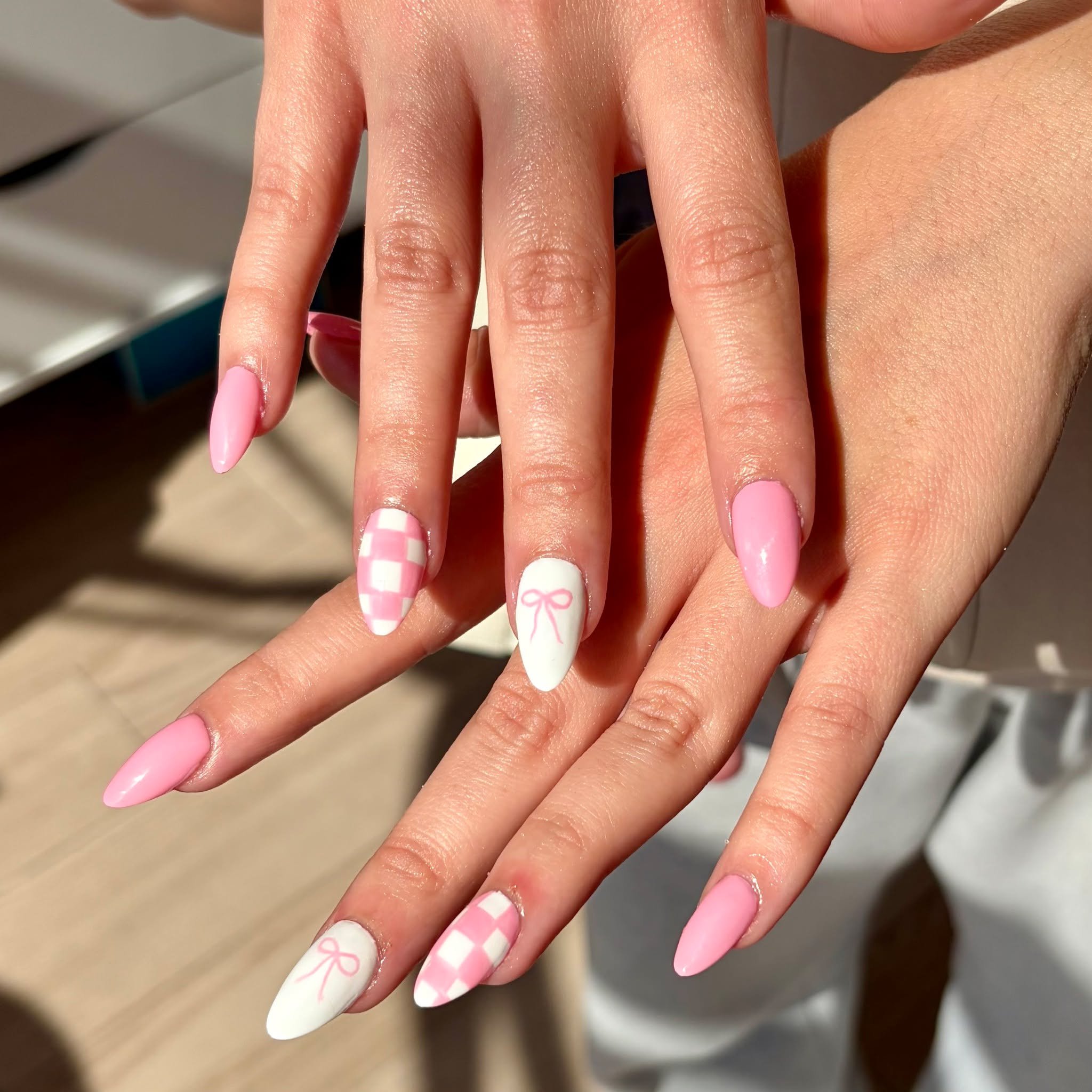 Pink checkers, tiny bows, and the cutest mani ever 💕 We&rsquo;re obsessed. // Tier 1 nail art by @jilli.nails 

Polished Hamilton is open Tuesday-Saturday from 10-7pm and Sunday 10-4! Book online @ polishedhamilton.com 

#nailsdesign #nailtechs #nai